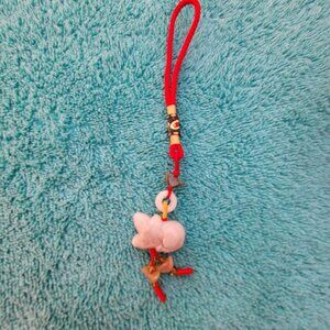 VINTAGE JADE ON A RED BREADED CORD